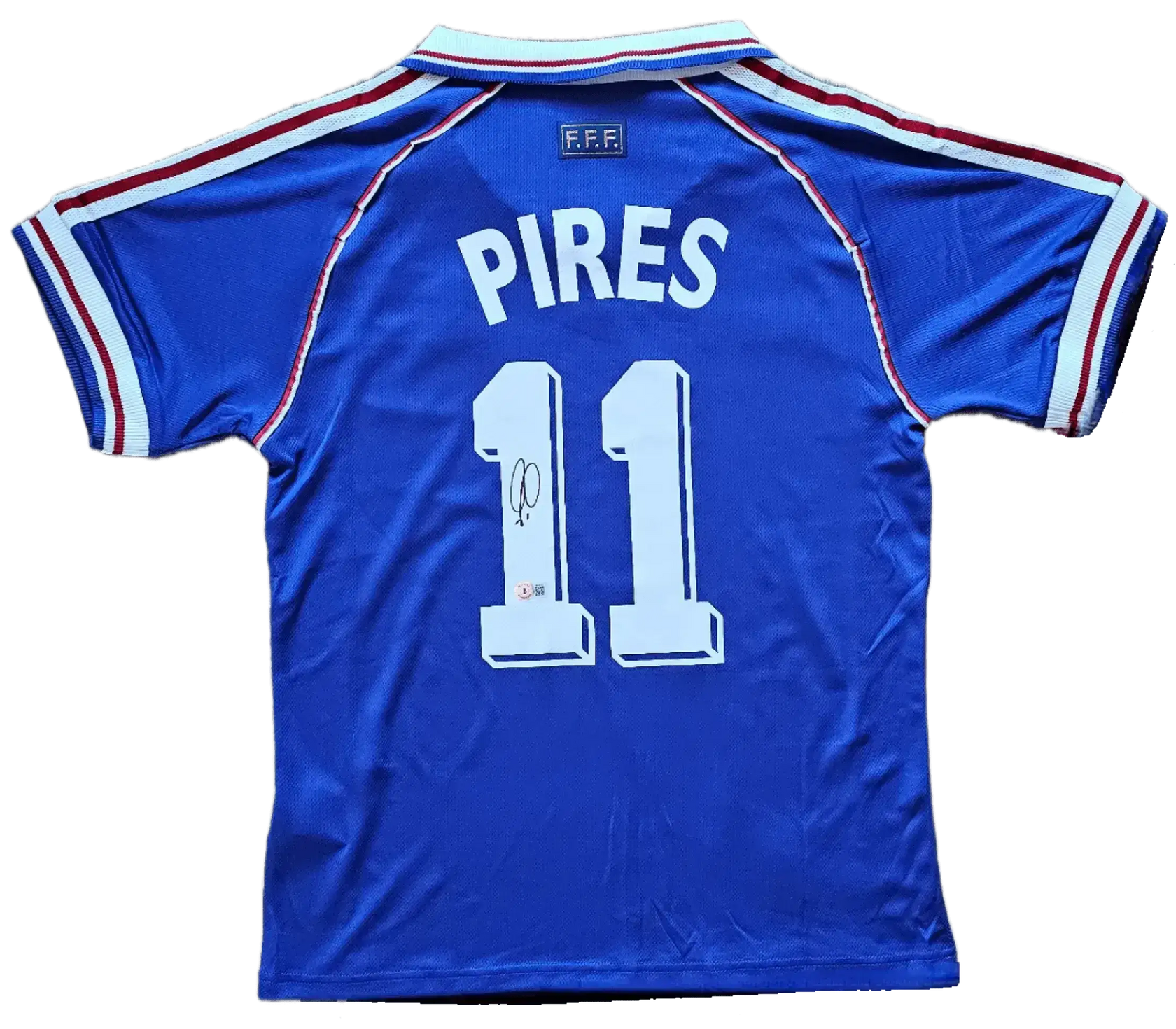 Back view featuring Pires, No. 11, and a visible signature detail on the soccer jersey.