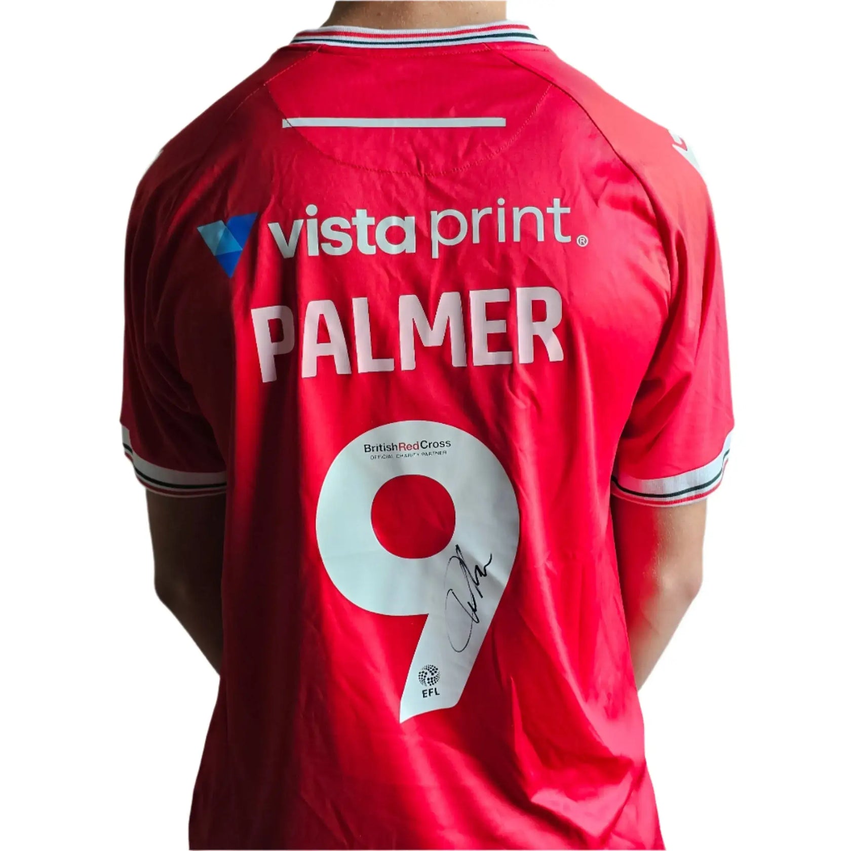 Back view of signed red soccer jersey with "PALMER" and No. 9, featuring British Red Cross logo.