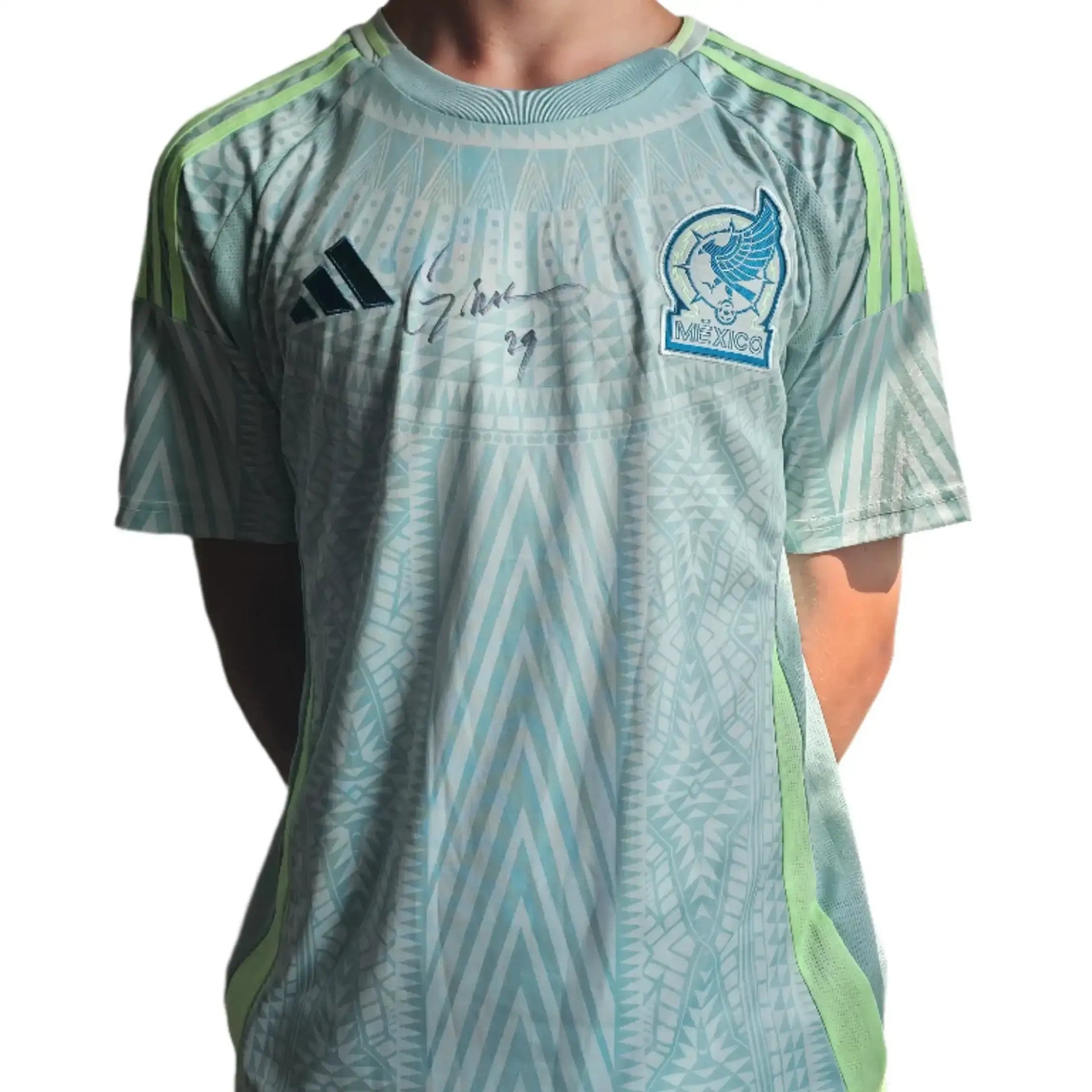 Front view of Santiago Giménez signed football shirt featuring Mexico crest and green accents.