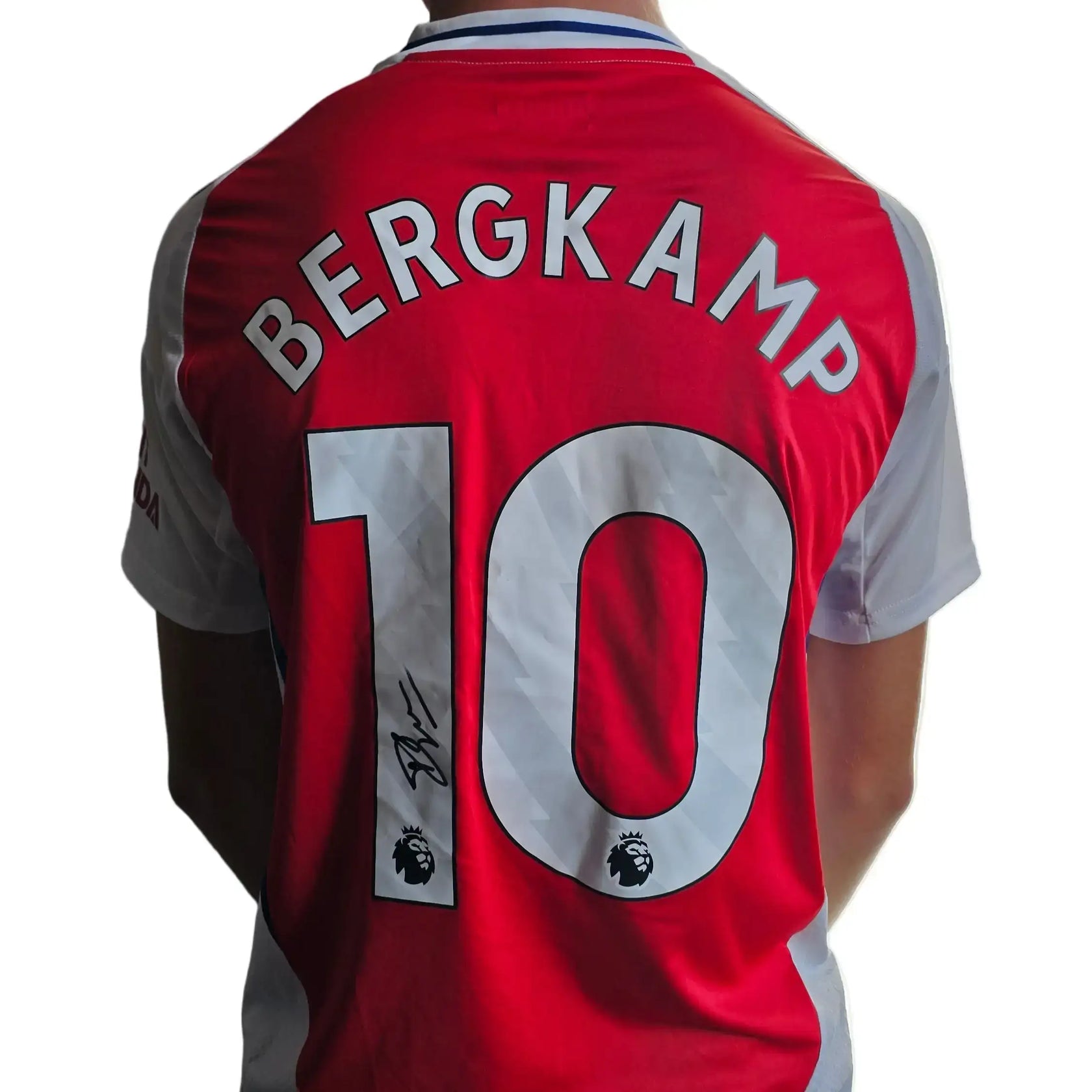 Back of red Arsenal shirt displaying name 'BERGKAMP', number '10', and a visible signature detail.