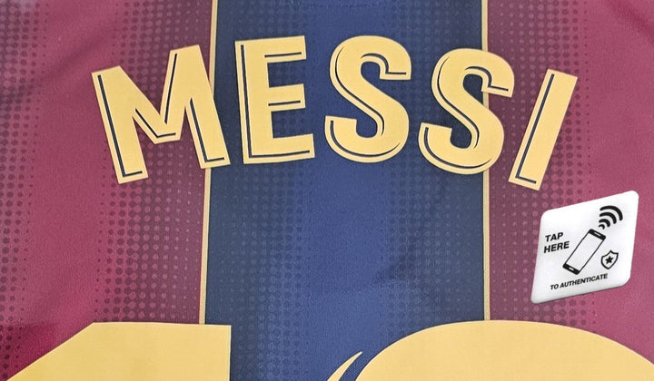 Back of Lionel Messi FC Barcelona 10 shirt with Icons TripleLock NFC tap-to-authenticate label positioned near the bottom-right of the name and number.