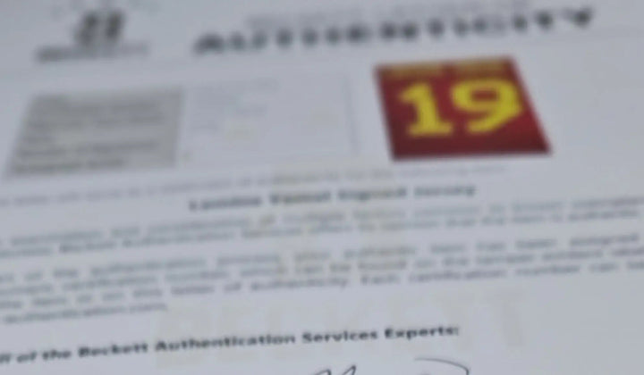 Blurred Beckett Letter of Authentication document with text and a red image featuring the number 19.