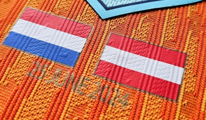 Match badge on Van Dijk’s Netherlands Euro 2024 football shirt: Dutch and Austrian flags above the date 25 June 2024.