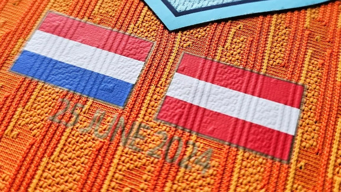 Match badge on Van Dijk’s Netherlands Euro 2024 football shirt: Dutch and Austrian flags above the date 25 June 2024.