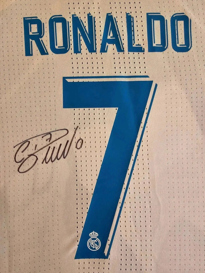 Back view showing Ronaldo, No. 7, and signature on Real Madrid 2017-2018 soccer jersey.