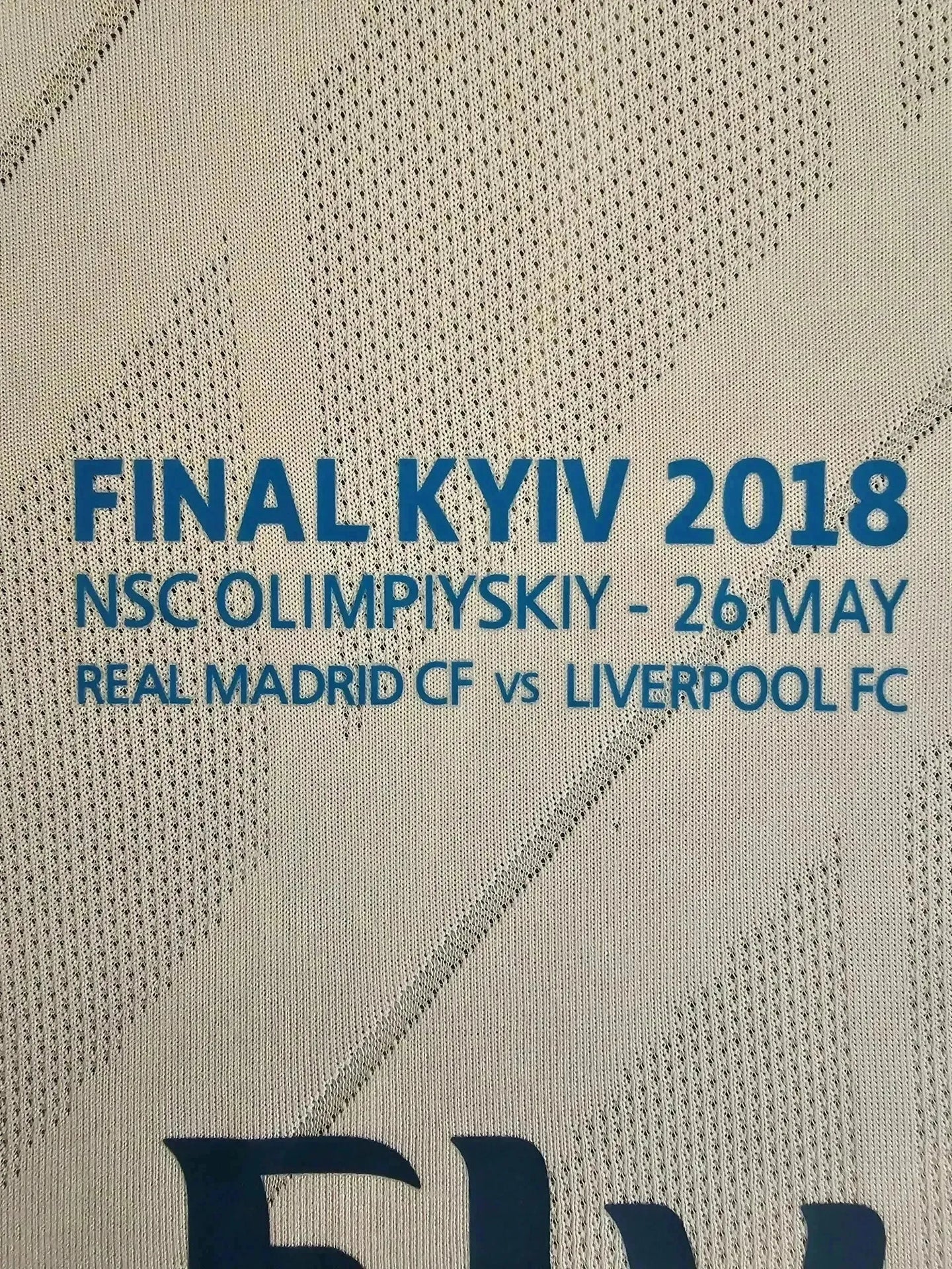 Crest detail showing "FINAL KYIV 2018", "NSC OLYMPIYSKYI - 26 MAY", "REAL MADRID CF vs LIVERPOOL FC".