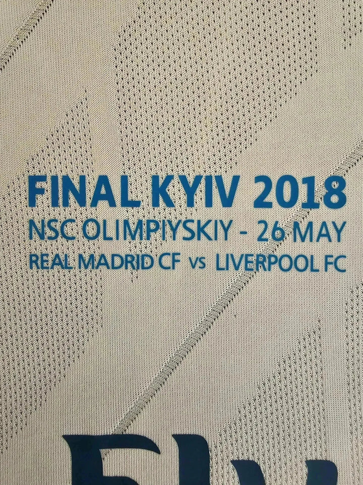 Crest detail showing "FINAL KYIV 2018", "NSC OLYMPIYSKYI - 26 MAY", "REAL MADRID CF vs LIVERPOOL FC".