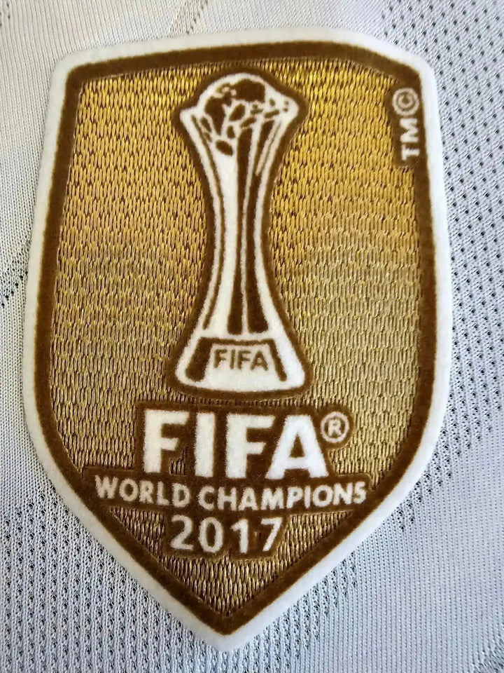 FIFA World Champions 2017 badge featuring the FIFA trophy in gold on a white background.