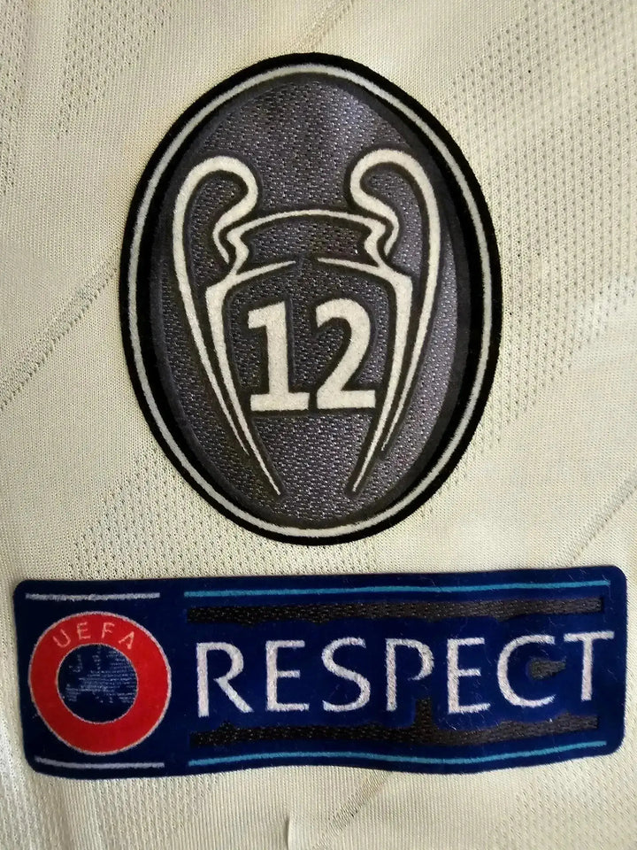 Detail showing UEFA Champions League crest with &