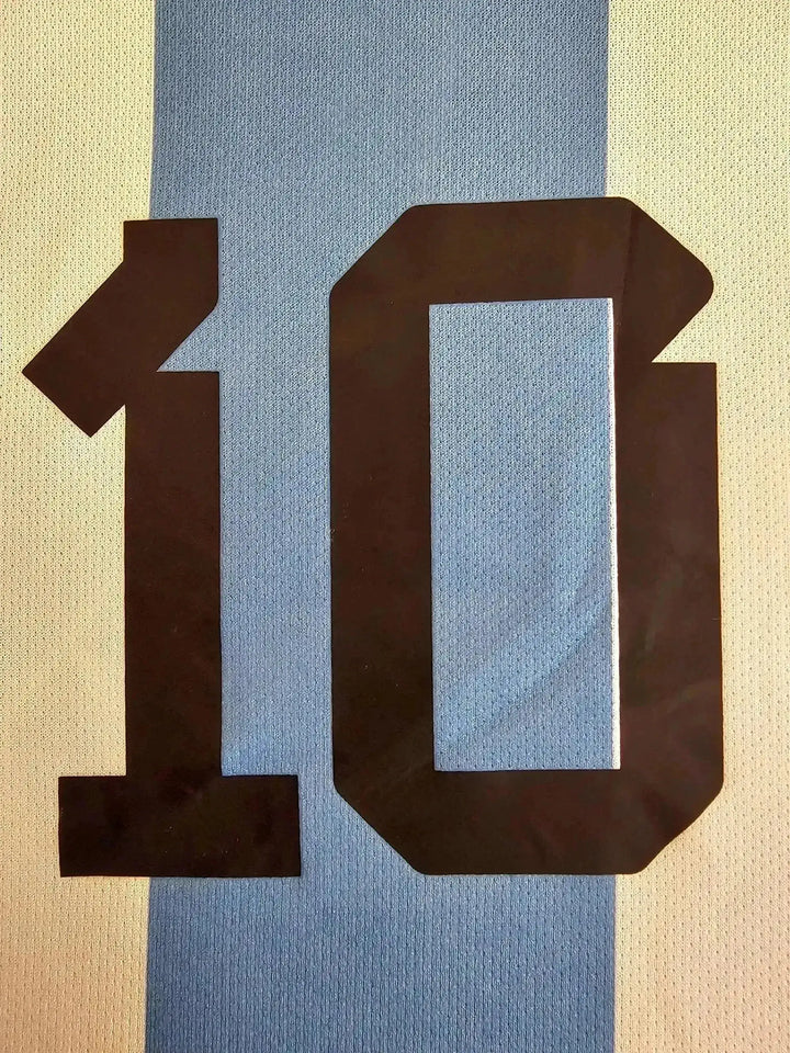 Detail view showing No. 10 in black on the Argentina soccer jersey.