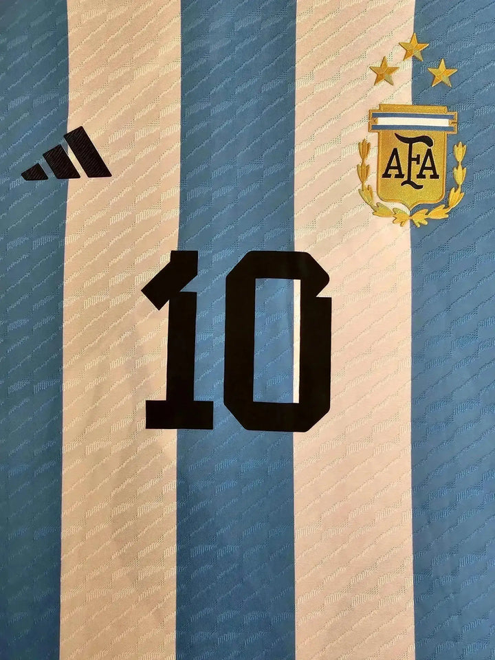 Front view featuring No. 10, adidas logo, and Argentina crest with three stars.
