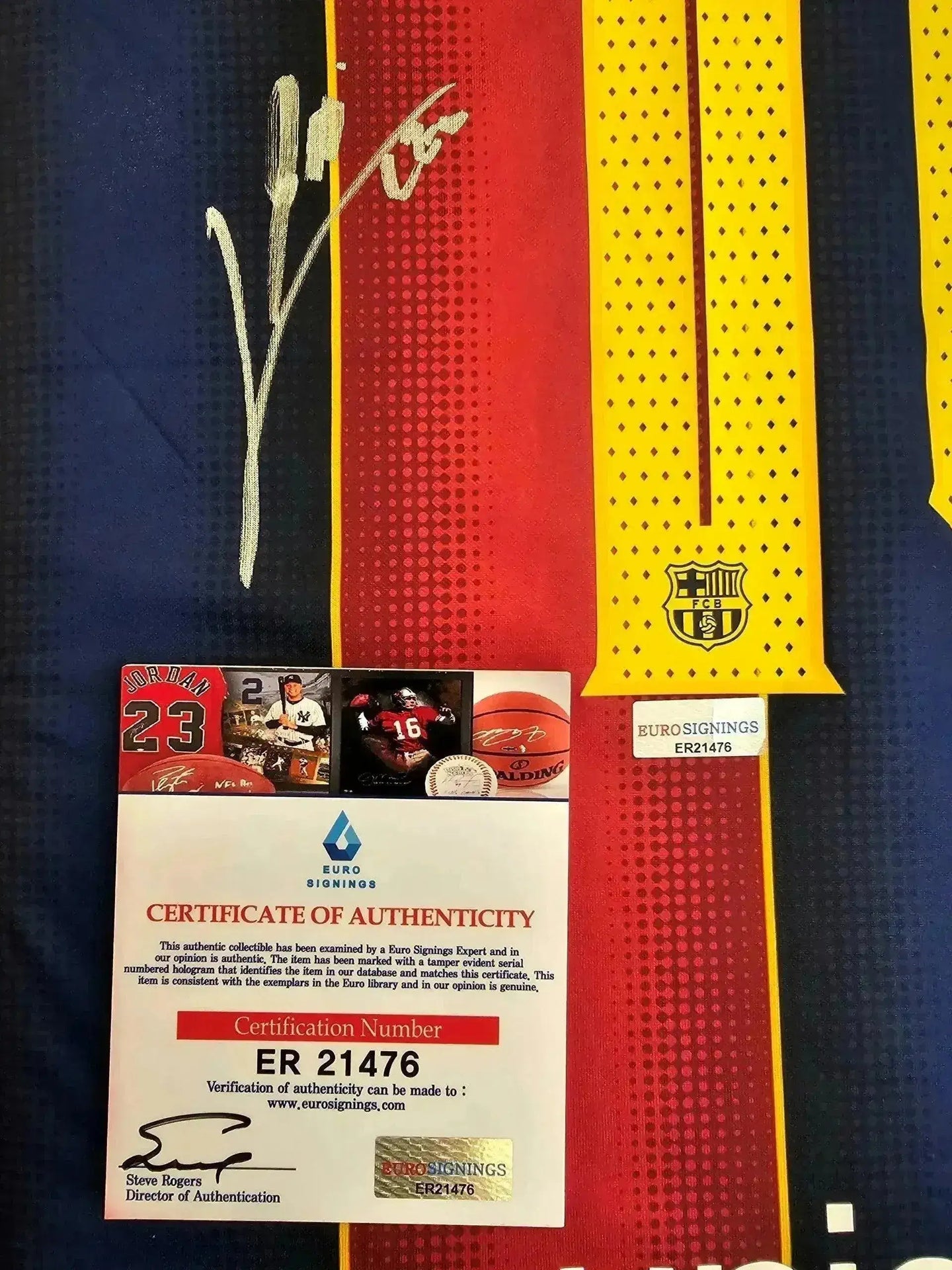 Signature detail on FC Barcelona soccer jersey featuring Lionel Messi's name and number 10.