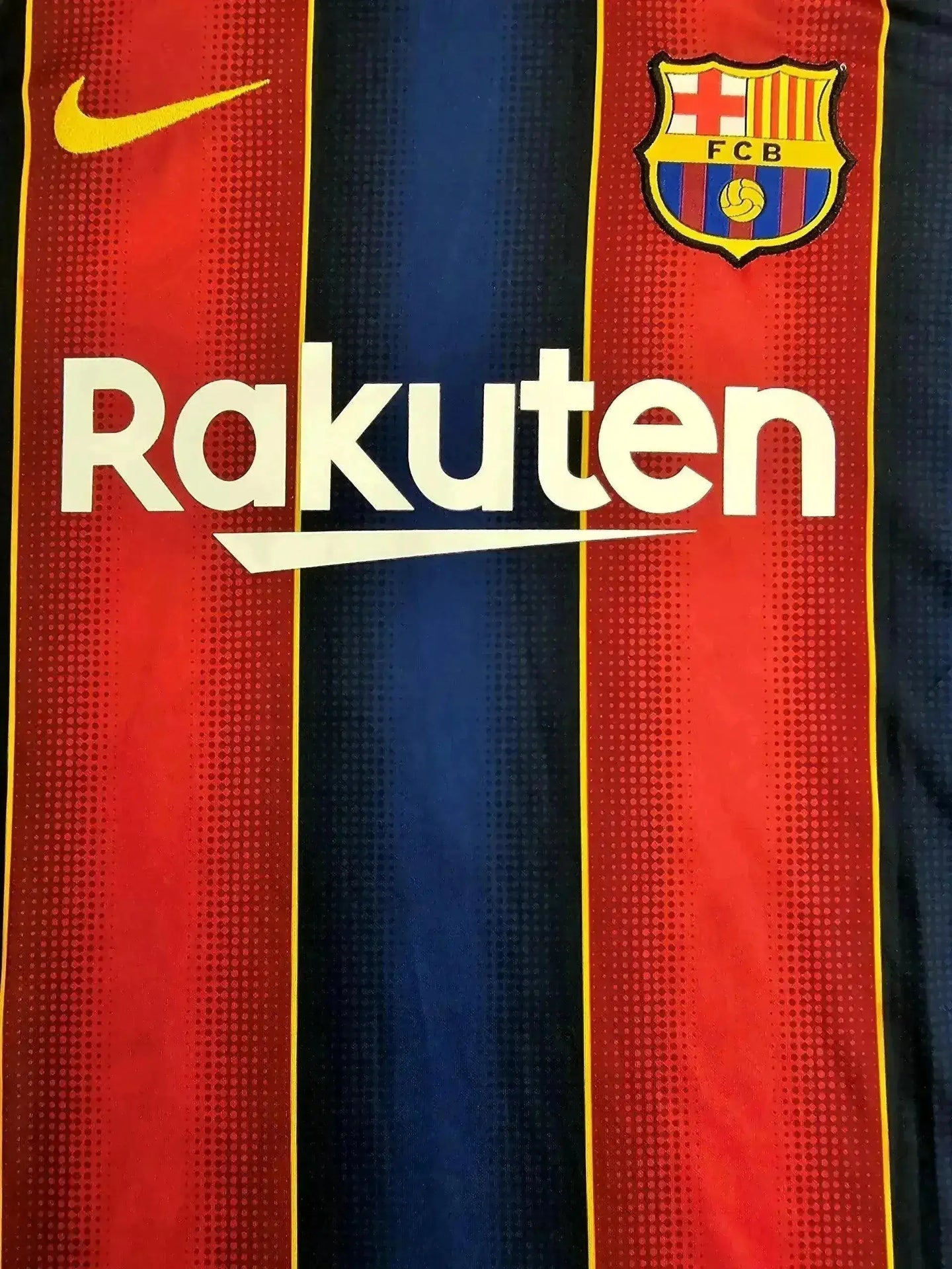 Front view showing the FC Barcelona crest, Rakuten sponsor, and Nike logo in red and blue stripes.