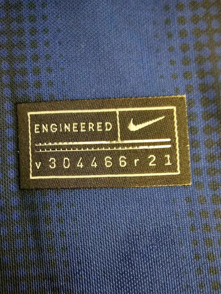 Close-up of Nike tag reading &
