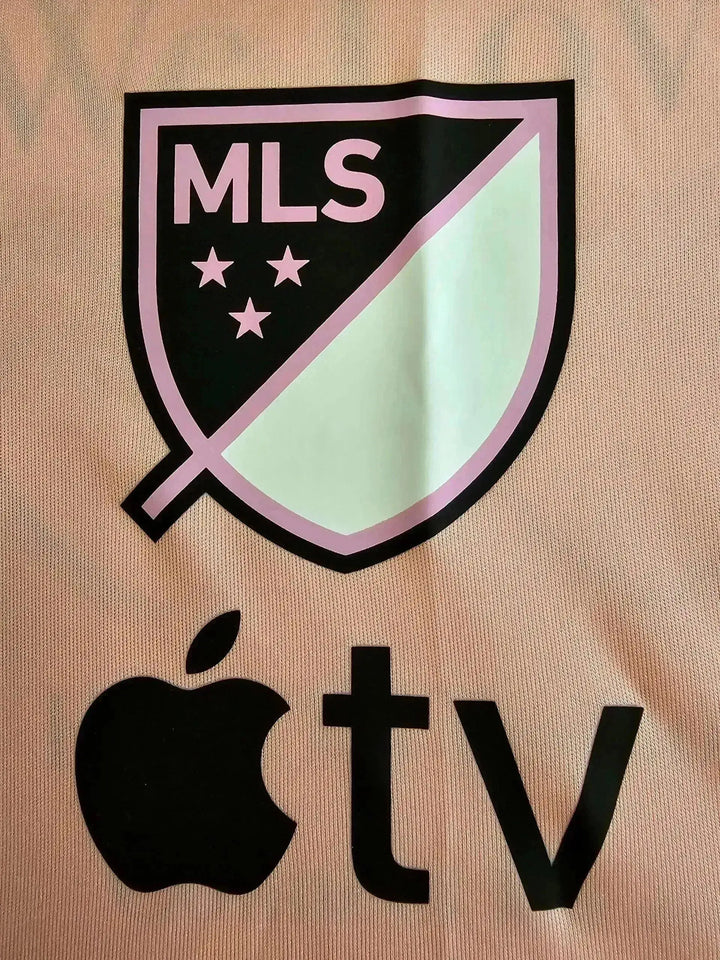 Crest detail showing MLS logo with three stars and Apple TV sponsorship logo.