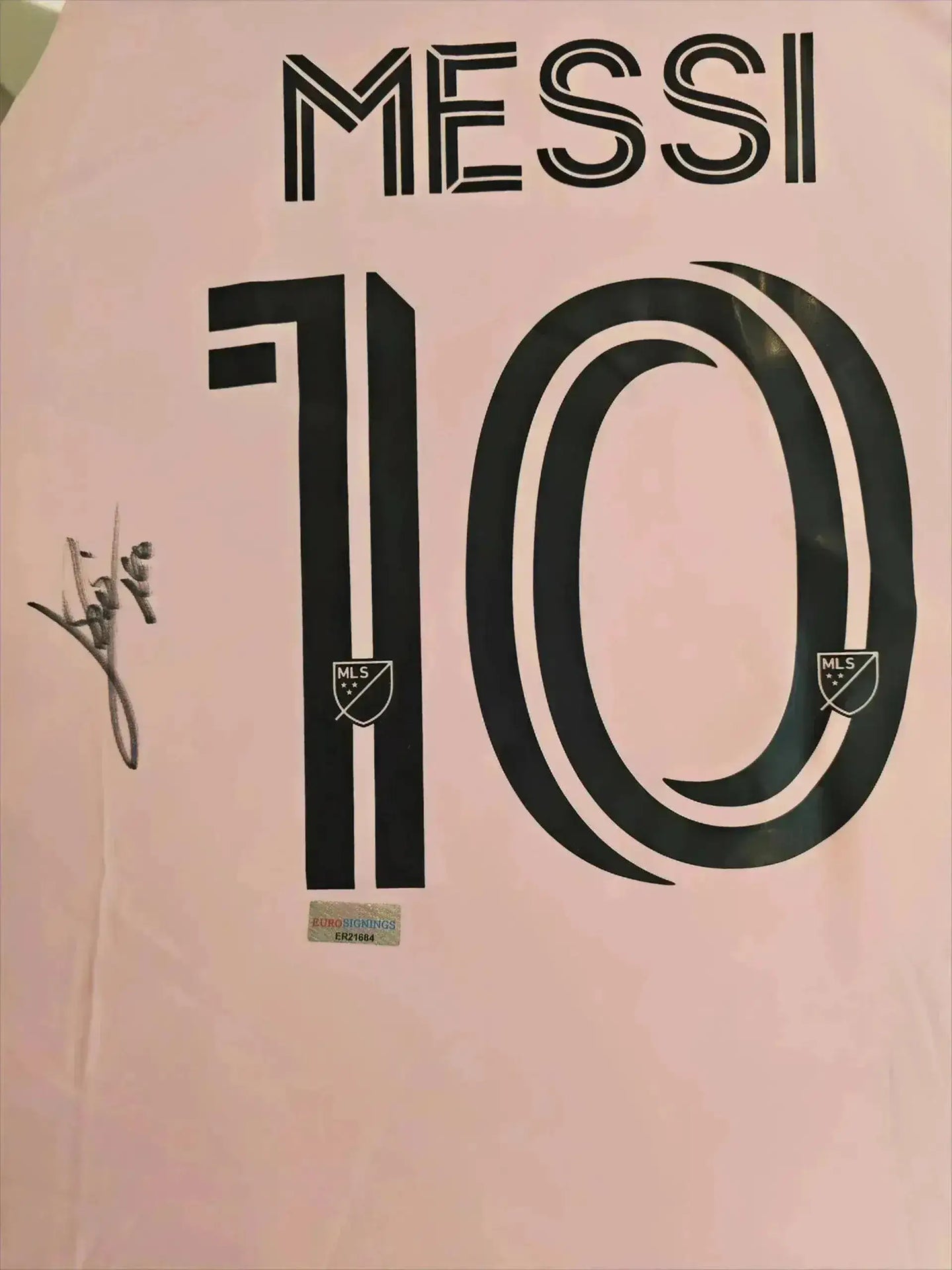 Back view displaying No. 10, 'MESSI', signature, and MLS badge.