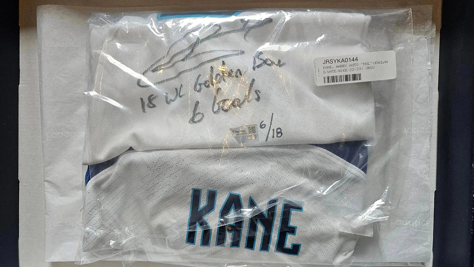 Detail view showing Harry Kane's signature, along with text reading '18 WC Golden Boot 6 goals' on jersey.