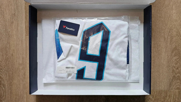 Front view of a signed soccer jersey featuring No. 9 and the Fanatics tag.