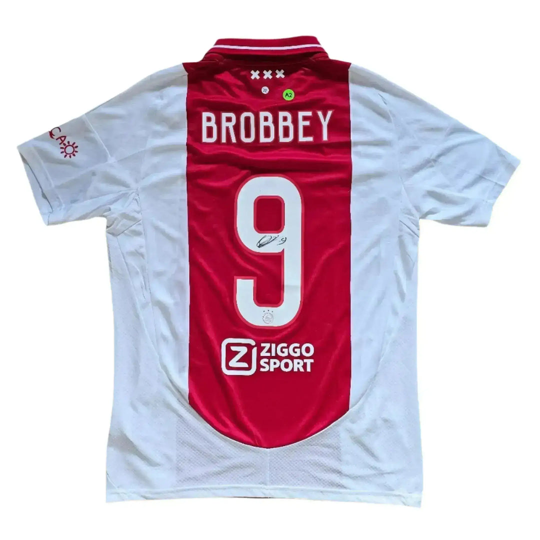 Back view featuring Brobbey, No. 9, and Ziggo Sport sponsor near the hem, with a visible signature.