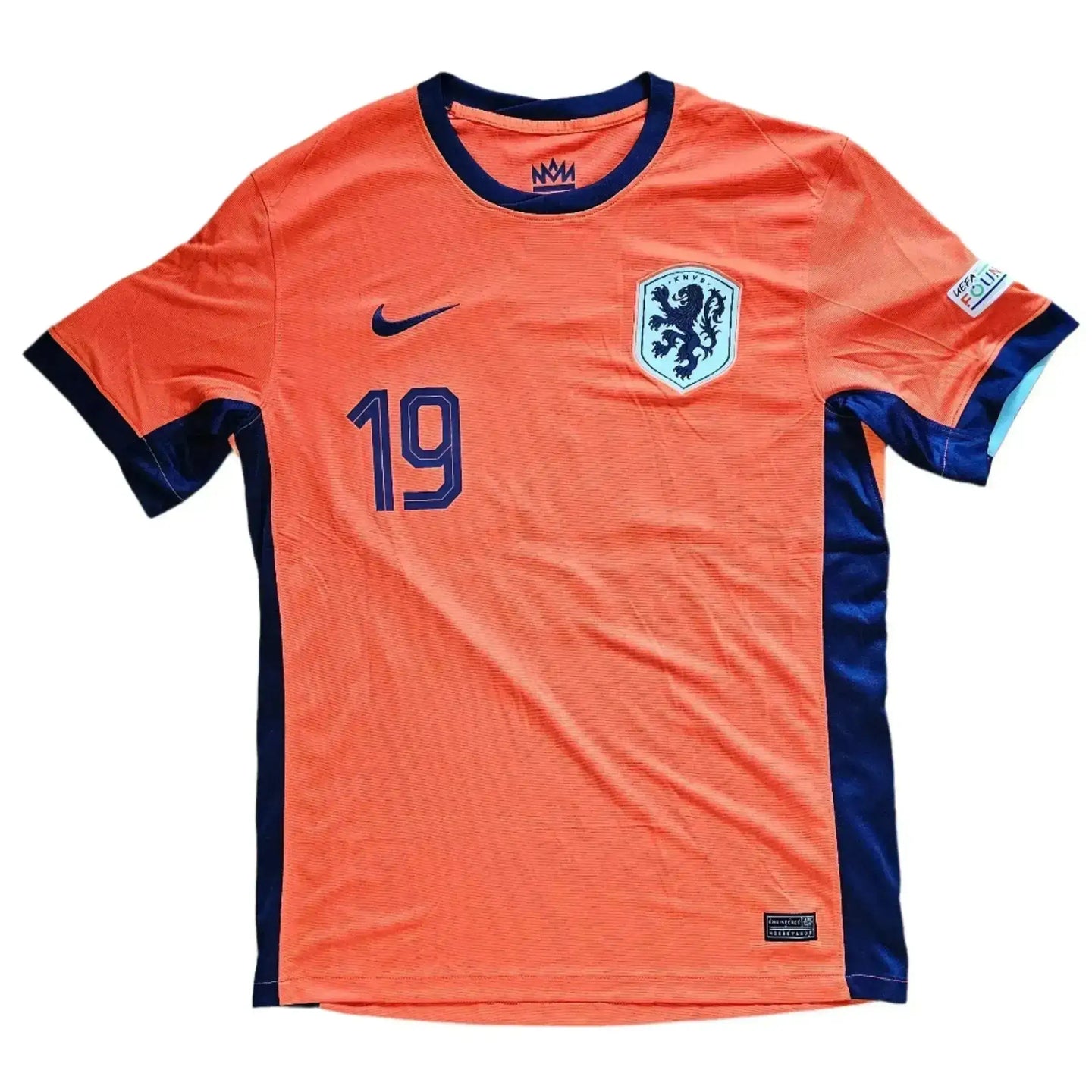 Front view of an orange football shirt featuring the Dutch lion crest and No. 19.