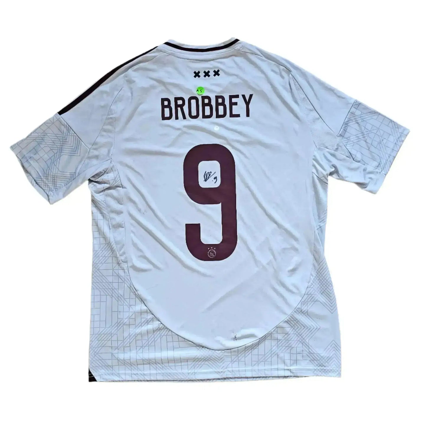 Back view showing Brobbey No. 9 with signature on a white football shirt.