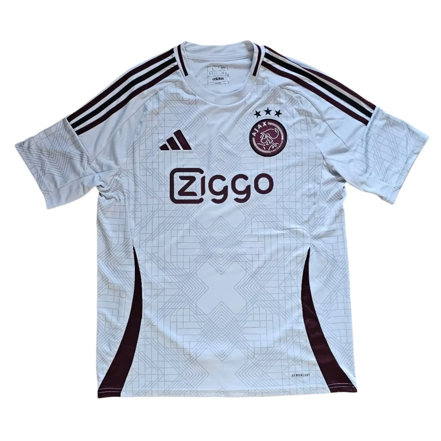 Front view of a signed Ajax football shirt featuring Ziggo logo and three stars above the crest.