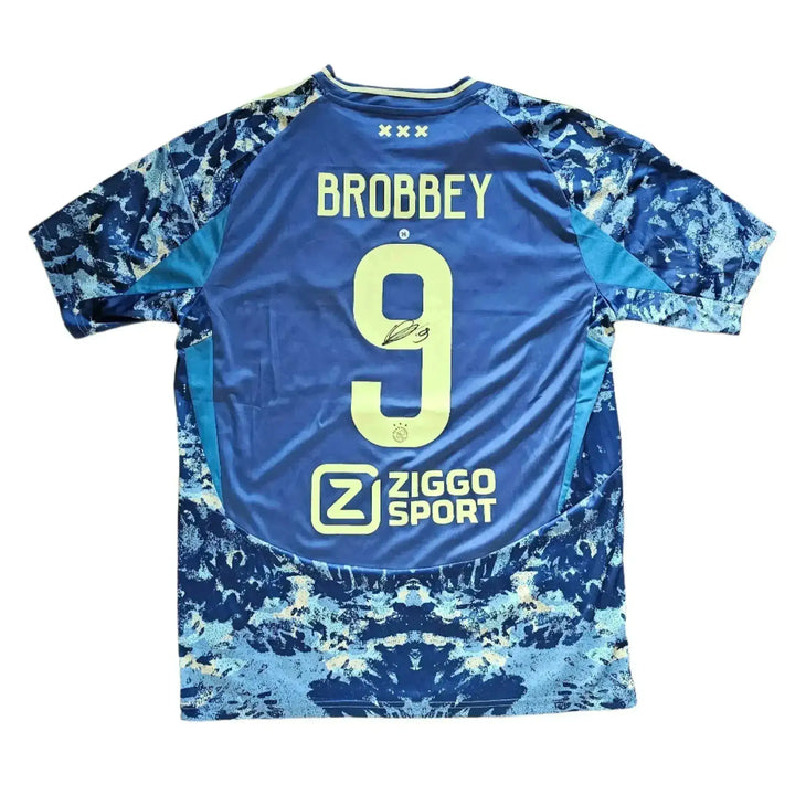 Back view showing Brobbey, No. 9, and signature details with Ziggo Sport logo.