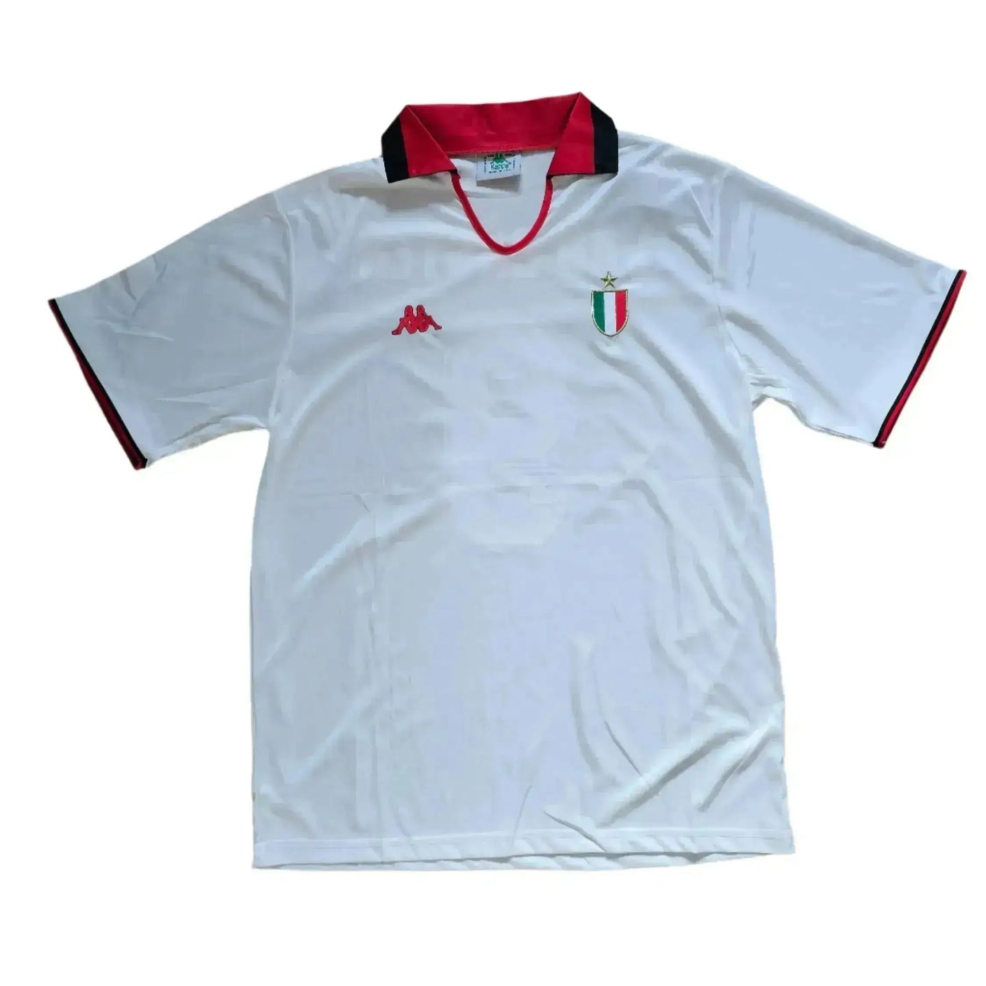 Front view of a signed white AC Milan football shirt featuring a red collar and crest.
