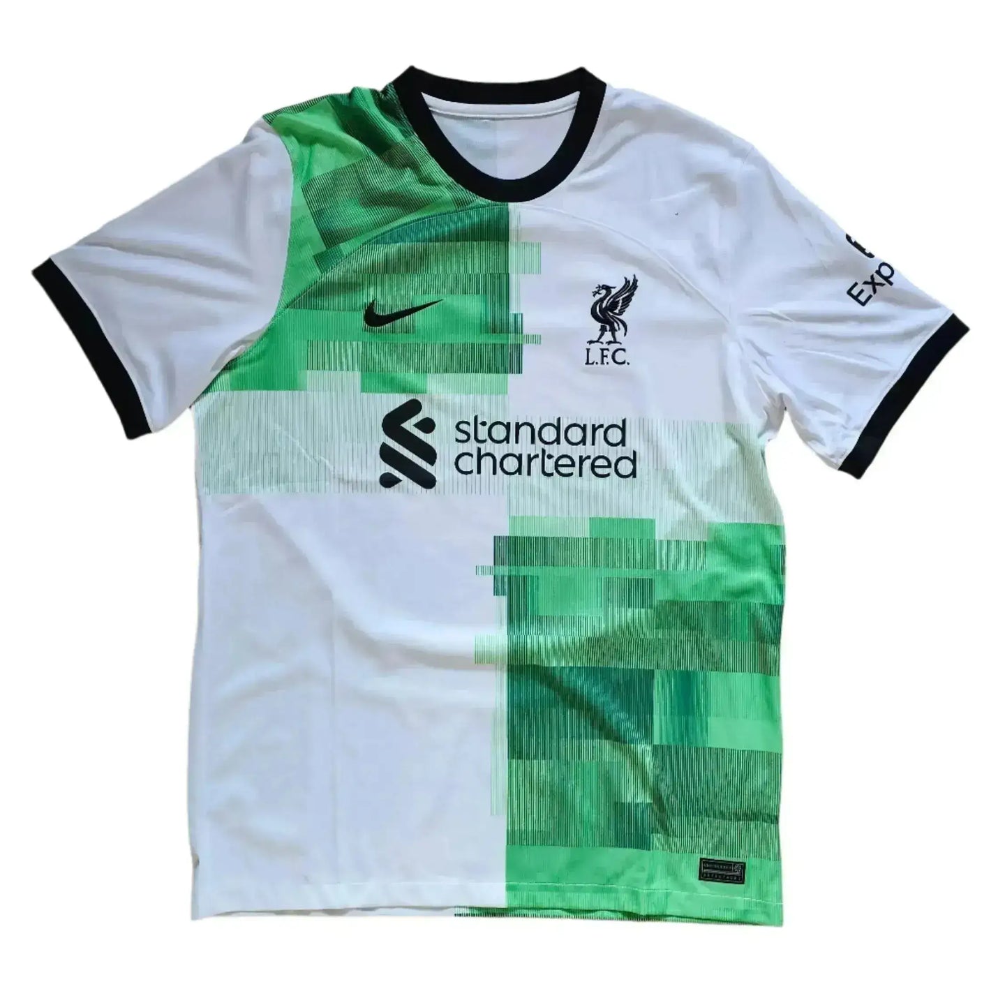 Front view of Liverpool football shirt with green pattern and Standard Chartered logo.
