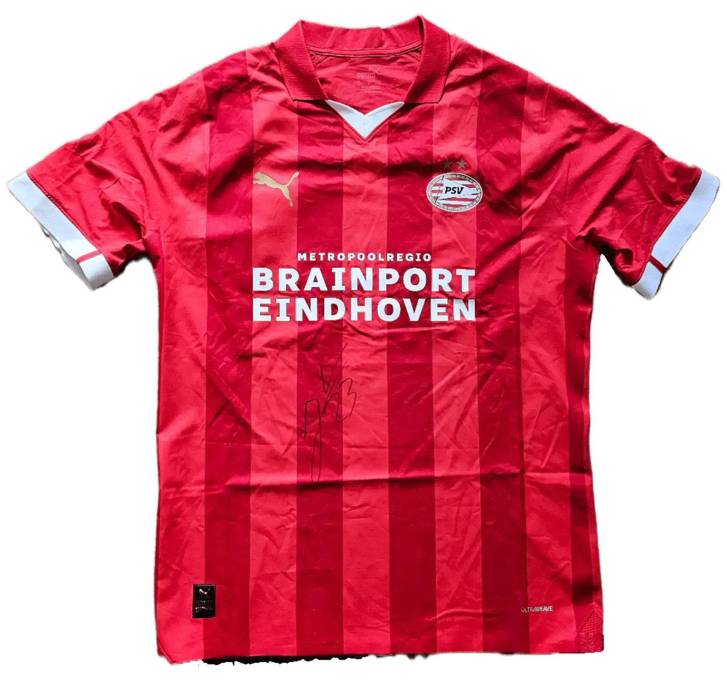 Front view of a signed PSV soccer jersey featuring the name Veerman and sponsor Brainport Eindhoven.