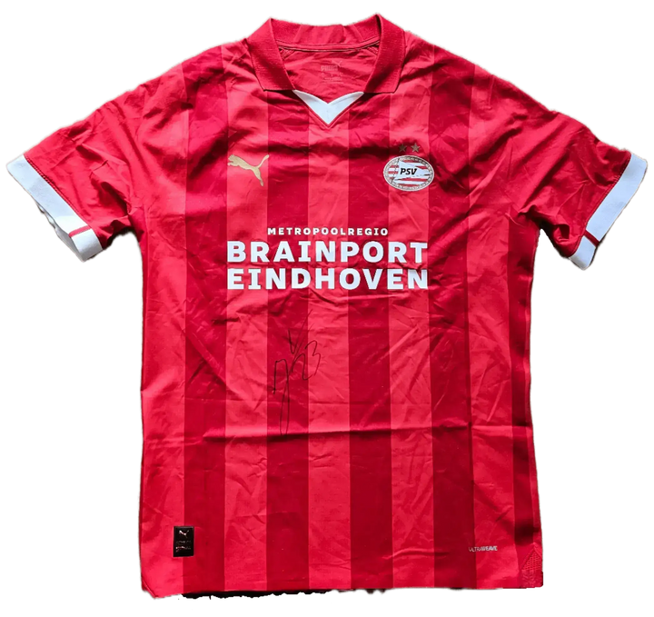 Front view of a signed PSV football shirt featuring the name Veerman and sponsor Brainport Eindhoven.