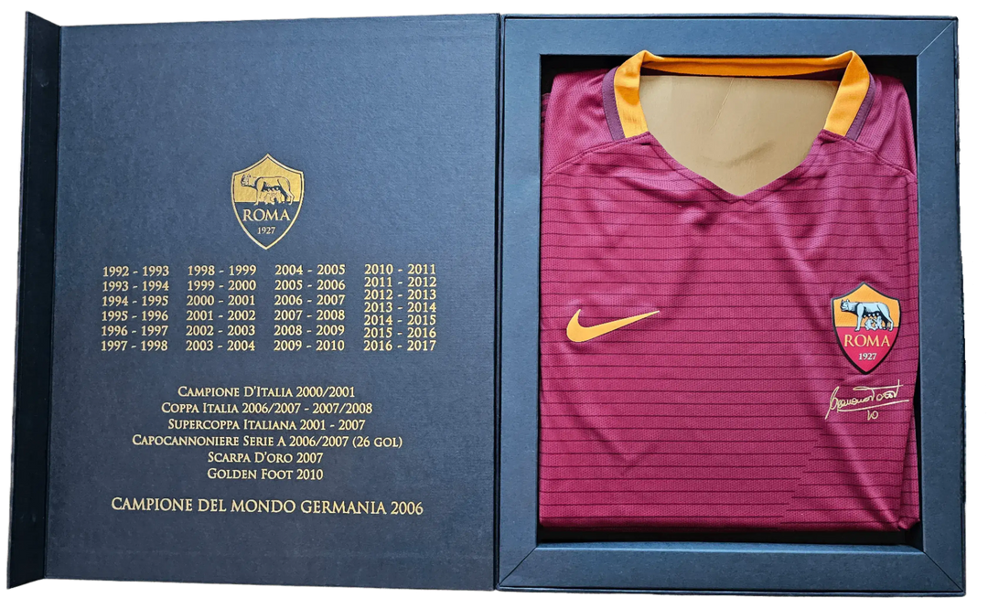 Francesco Totti No. 10 signature and A.S. Roma crest on red football shirt in presentation box.