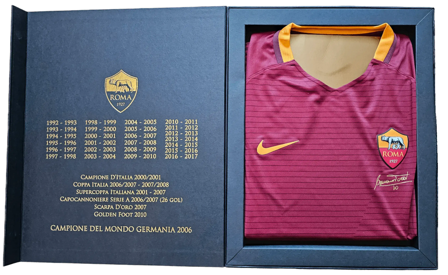 Francesco Totti No. 10 signature and A.S. Roma crest on red football shirt in presentation box.