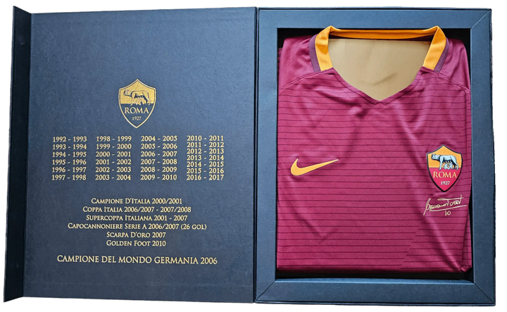 Francesco Totti No. 10 signature and A.S. Roma crest on red football shirt in presentation box.