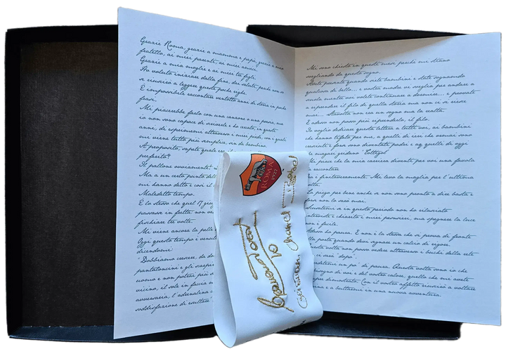 Booklet with handwritten notes and Roma crest, featuring signed message from Totti.
