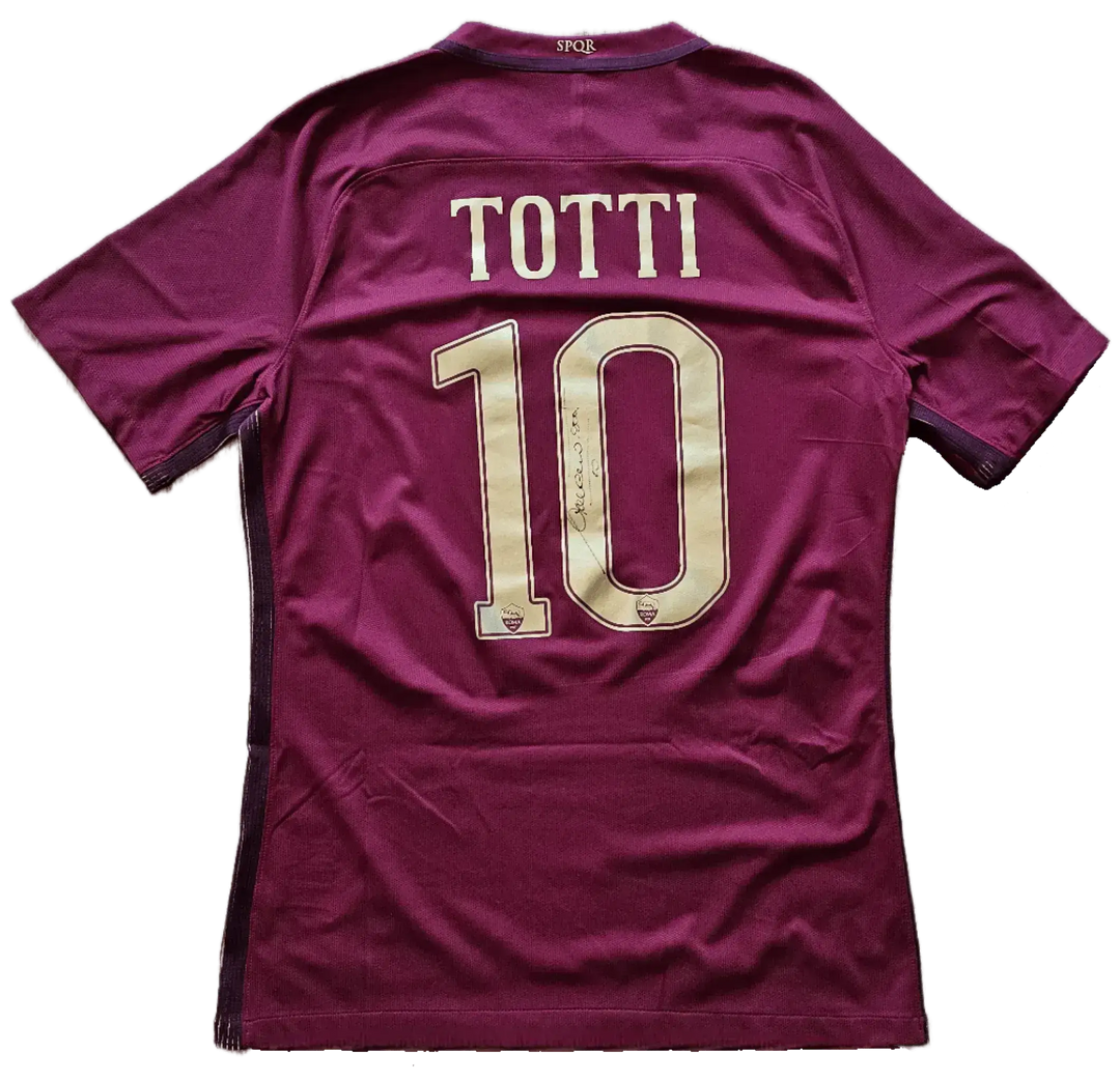Back view showing No. 10 and signature of Totti on a maroon football shirt.