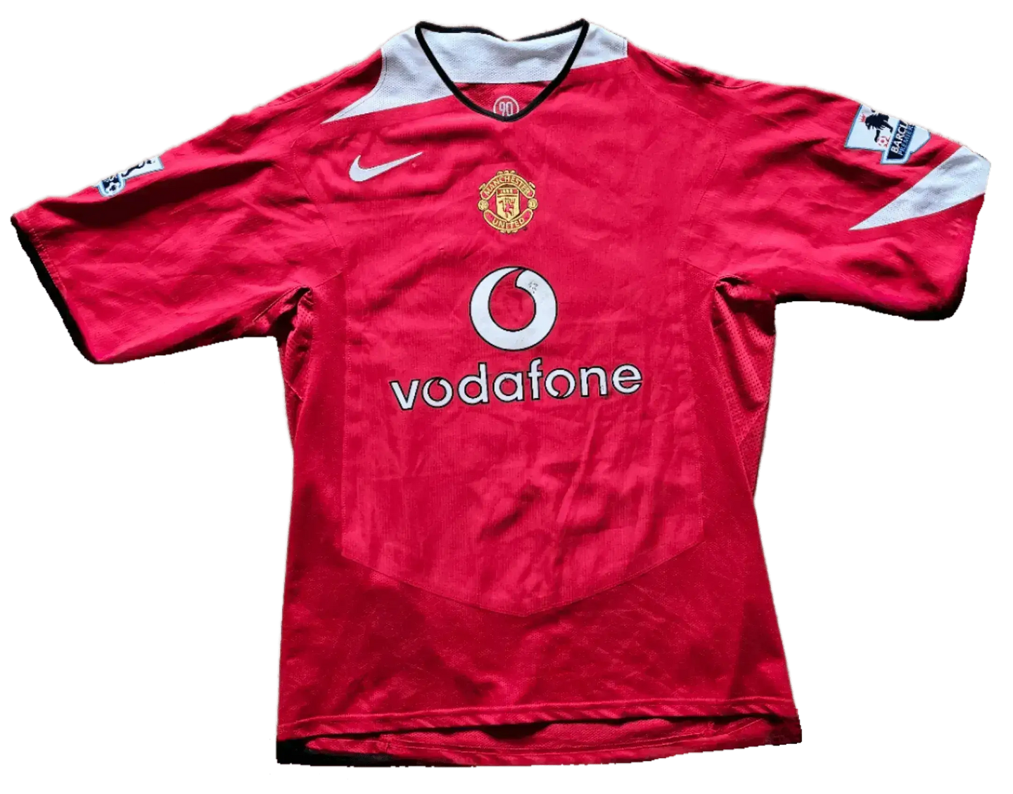 Front view of a signed Manchester United 10 soccer jersey featuring Vodafone and club crest.
