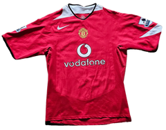 Front view of a signed Manchester United 10 soccer jersey featuring Vodafone and club crest.