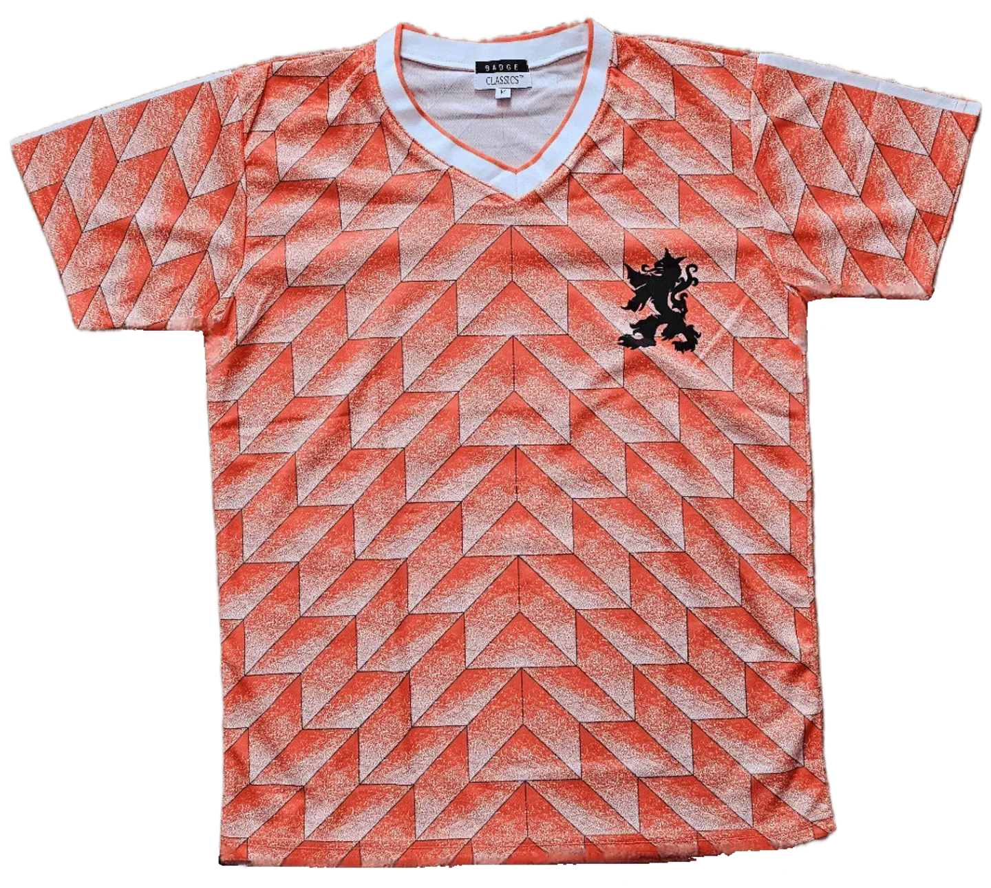 Front view of Ruud Gullit signed soccer jersey featuring a vibrant orange geometric pattern and a black lion crest.