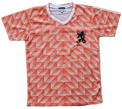 Front view of Ruud Gullit signed soccer jersey featuring a vibrant orange geometric pattern and a black lion crest.