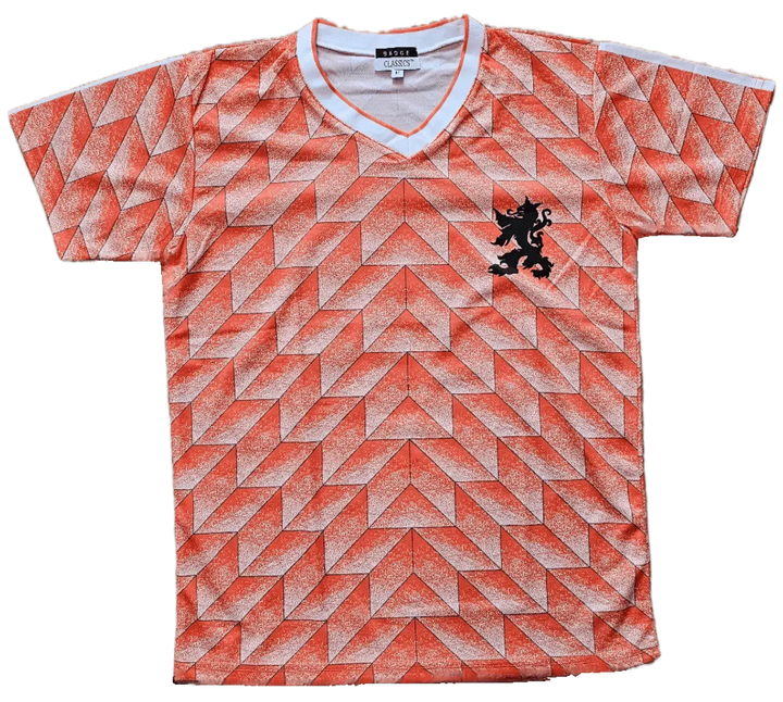 Front view of Ruud Gullit signed football shirt featuring a vibrant orange geometric pattern and a black lion crest.