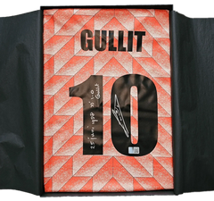 Signed soccer jersey by Gullit, featuring No. 10 and handwritten signature detail.