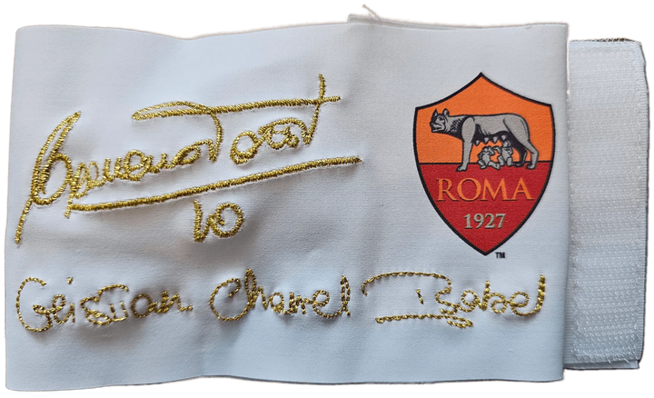Gold embroidered signature and No. 10 with A.S. Roma crest on captains band.