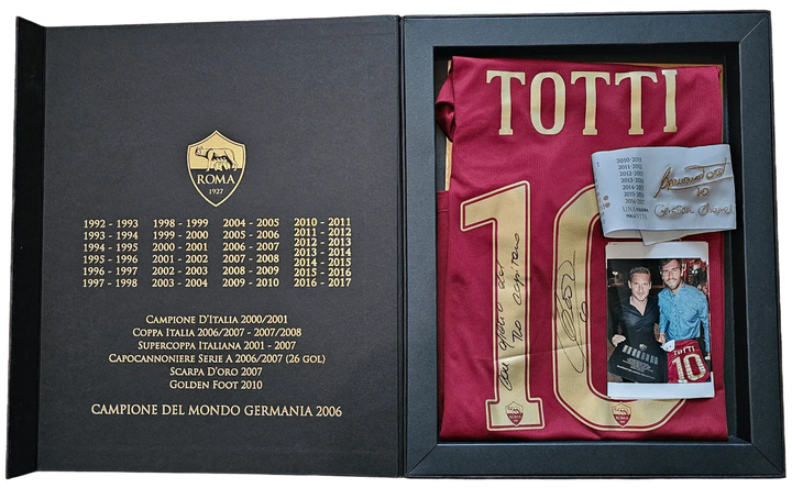 Francesco Totti No. 10 football shirt signed, displayed in presentation box with ROMA crest and achievements listed.