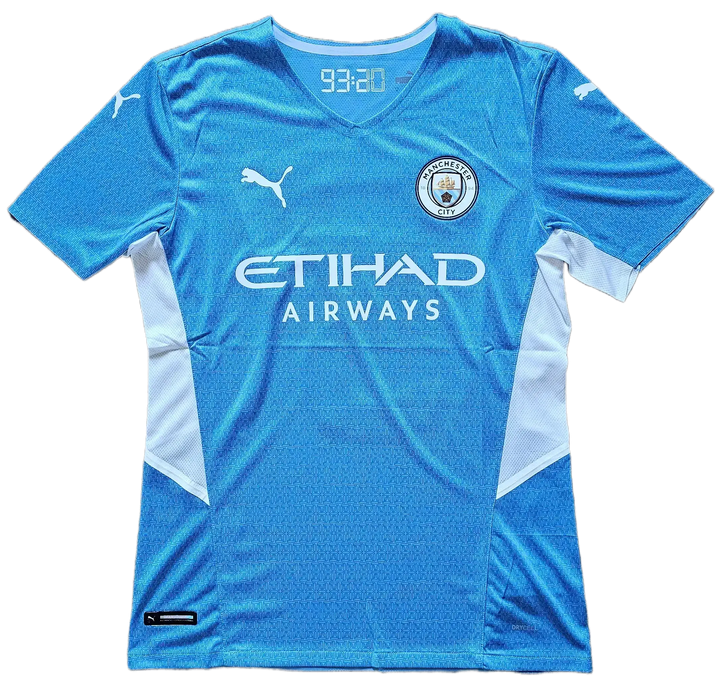 Front view featuring Manchester City crest, ETIHAD AIRWAYS logo, and a background color of sky blue.