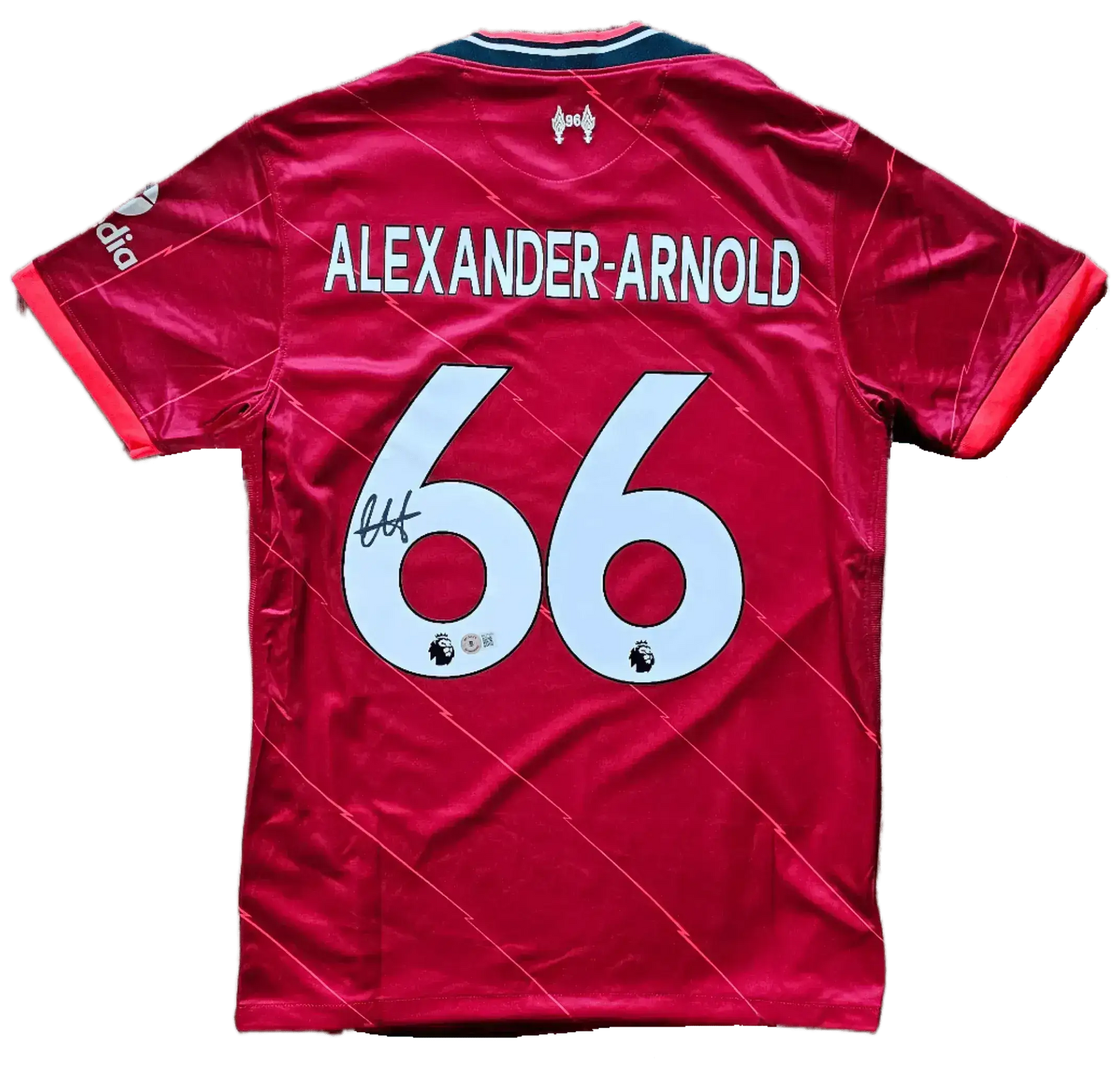 Back view featuring Alexander-Arnold, No. 66, with a visible signature.