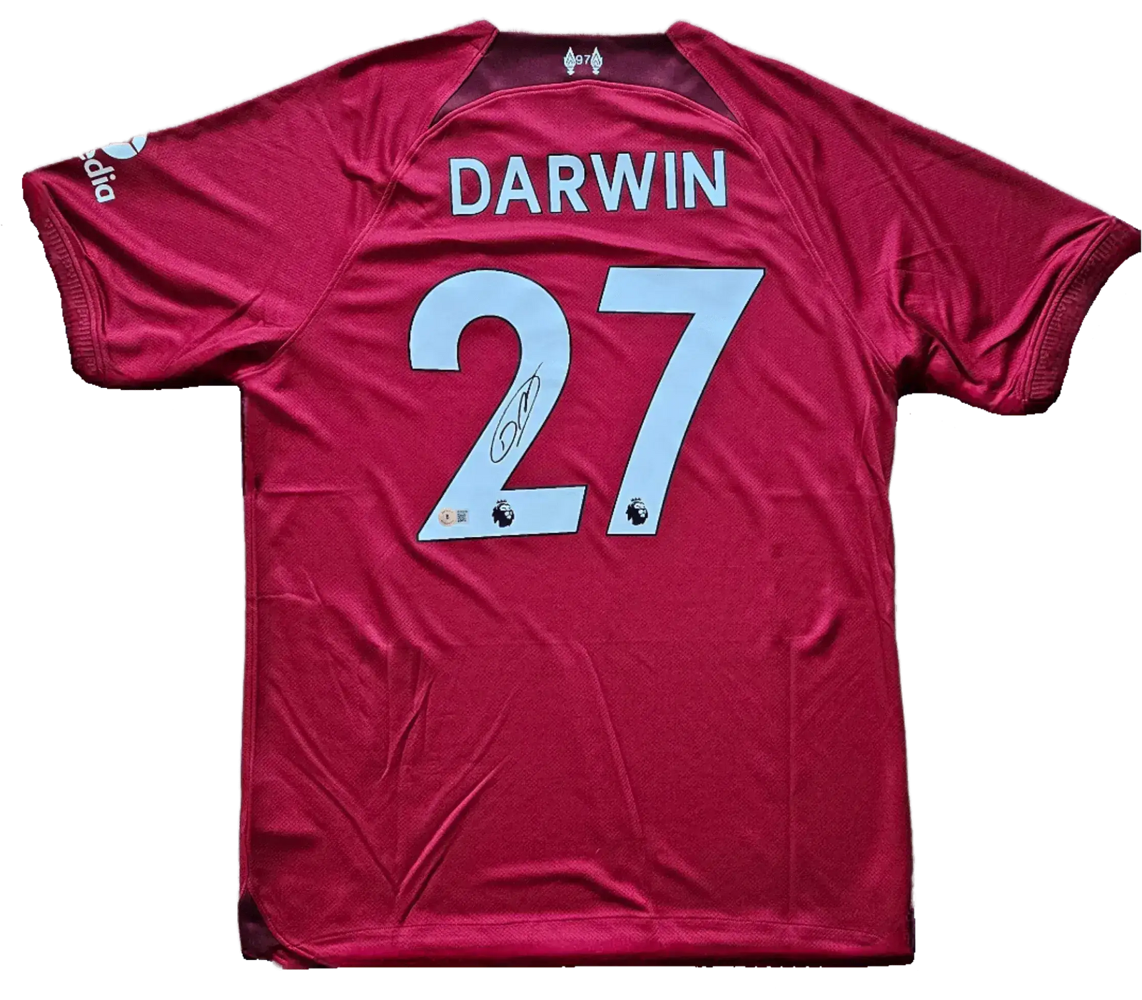 Back view featuring No. 27 and signature on a red soccer jersey labeled DARWIN.