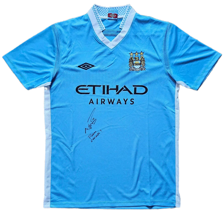 Front view of Manchester City football shirt featuring signature and ETIHAD AIRWAYS sponsor.