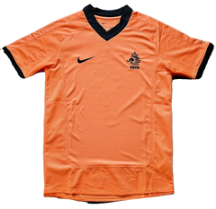 Front view of Patrick Kluivert 9 Holland signed soccer jersey displaying orange color and KNVB crest.