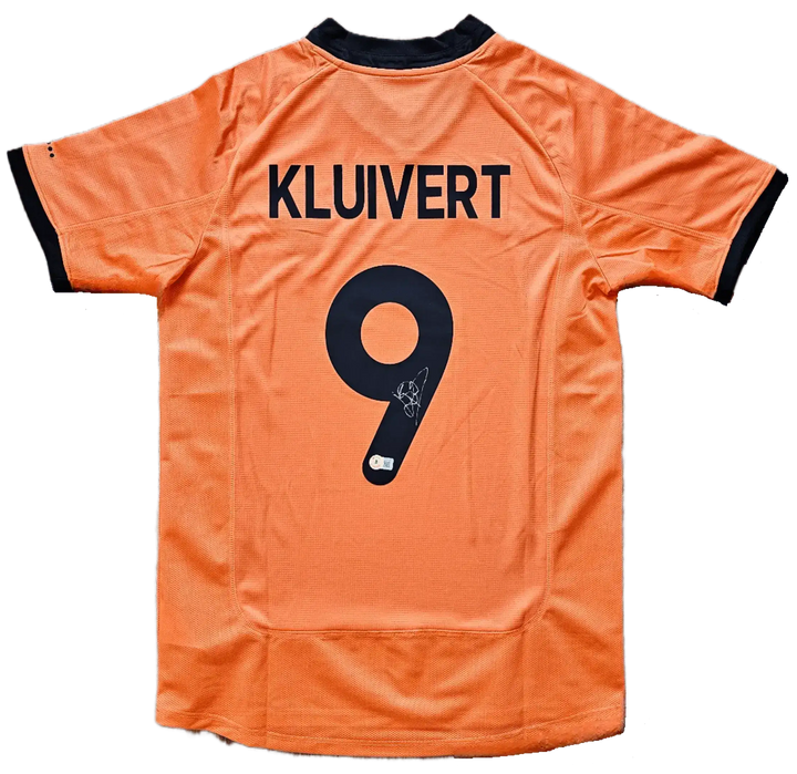 Back view showing KLUIVERT and No. 9 with a visible signature on the Netherlands orange shirt.